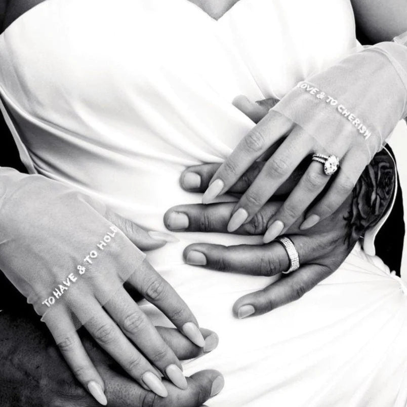 2 brides posing in floral wedding dresses